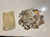 overview of cotton drawstring pouch and spread of coins