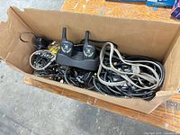 Overview of box with radios, cradle and mixed cables