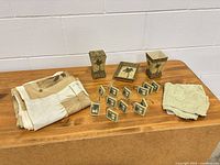 entire lot laid out: folded shower curtain, two resin holders, soap dish, hooks, washcloth