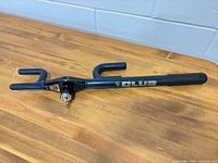 Full view of The Club steering wheel lock showing hooks, lock mechanism and key