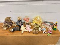 group shot of all toys and items on wooden surface