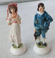 Front view of both Goebel figurines showing overall design and condition