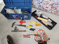 Overall lot showing blue Mastercraft toolbox, black organiser tray, hand tools and hardware on floor