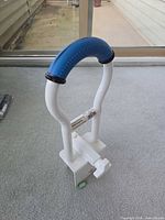 Full view of grab bar showing double rail, blue grip, clamp and adjustment knob