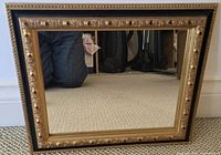 Rectangular mirror with gold and black frame