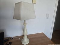 Cream painted lamp full view on table