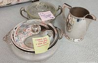 Overview of two covered dishes and pitcher
