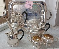 Full view of six-piece silverplate tea service on tray