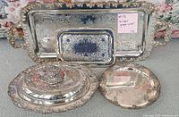 All four silver-plated pieces displayed together