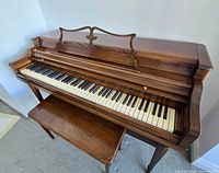 Top view of Wurlitzer upright piano keys and bench