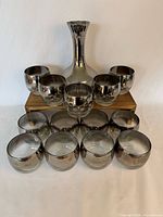 Full set showing decanter and 12 visible tumblers
