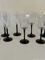 Group of 4 champagne flutes and 6 wine glasses showing styles together