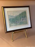 Framed print on easel showing overall artwork and frame