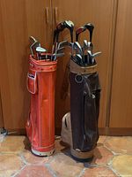 Full view of both vintage golf bags with clubs inside