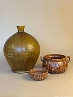 Front view of all three pottery pieces