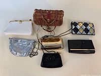 All seven purses laid out showing variety