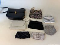 All eight purses laid out