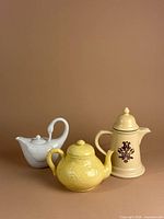 Front view of all three teapots