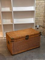 Full view of wicker rattan trunk closed, showing overall form and size