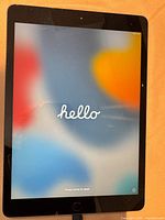 iPad front powered on showing setup screen