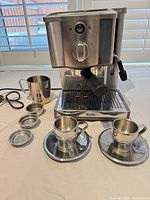 Full view of espresso machine with all accessories arranged