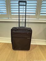 Front view of suitcase with telescopic handle extended