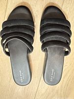 Top view of both sandals showing multi-strap design and insole branding