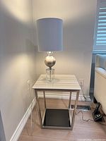 Front view of side table with lamp on top (lamp not included)