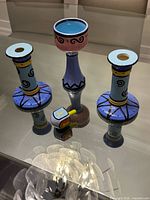 Group shot showing goblet candle holder, two candlesticks, and dreidel