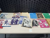 Overall view of sheet music lot spread on table