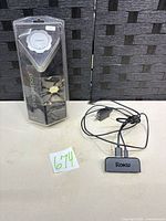 Callpod Chargepod package and Roku adapter on surface