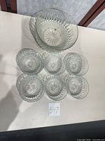 Punch bowl with six matching small bowls displayed