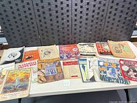 Full table view showing entire lot of early 1900s sheet music