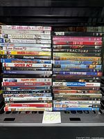 Full frontal view of three DVD stacks showing titles and confirming quantity