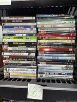 Two stacks of DVD cases showing spines and titles for quantity confirmation