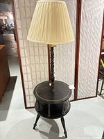 Full view of floor lamp with shade and integrated table