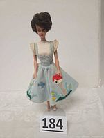 Full view of Barbie doll wearing Friday Night Date outfit standing upright