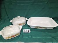 Three casseroles with lids on two, showing pattern and size