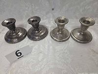 Front view showing all four candle holders, two styles
