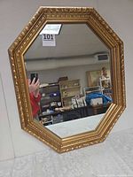 Full view of octagonal mirror on wall