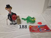 Both toys side by side with frog packaging visible