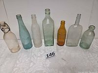 Front view of all seven bottles lined up