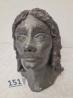 front view of dark clay bust