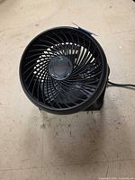 Front view of Honeywell tabletop fan showing grille and logo