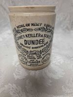 Front view showing full jar with printed labeling and glaze