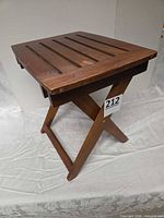 full view of wooden folding patio table standing