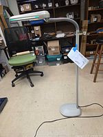 Full view of Ott-Lite floor lamp standing on base