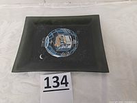 Front view of plate showing satellite graphic