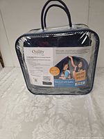 Weighted blanket inside branded clear case front