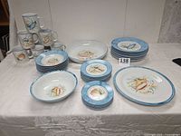 Full dinnerware set arranged on table
